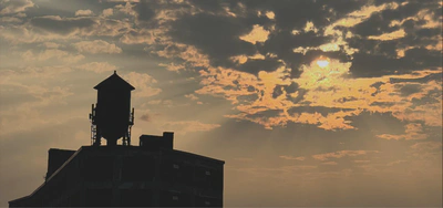 Water Tower with Sunset